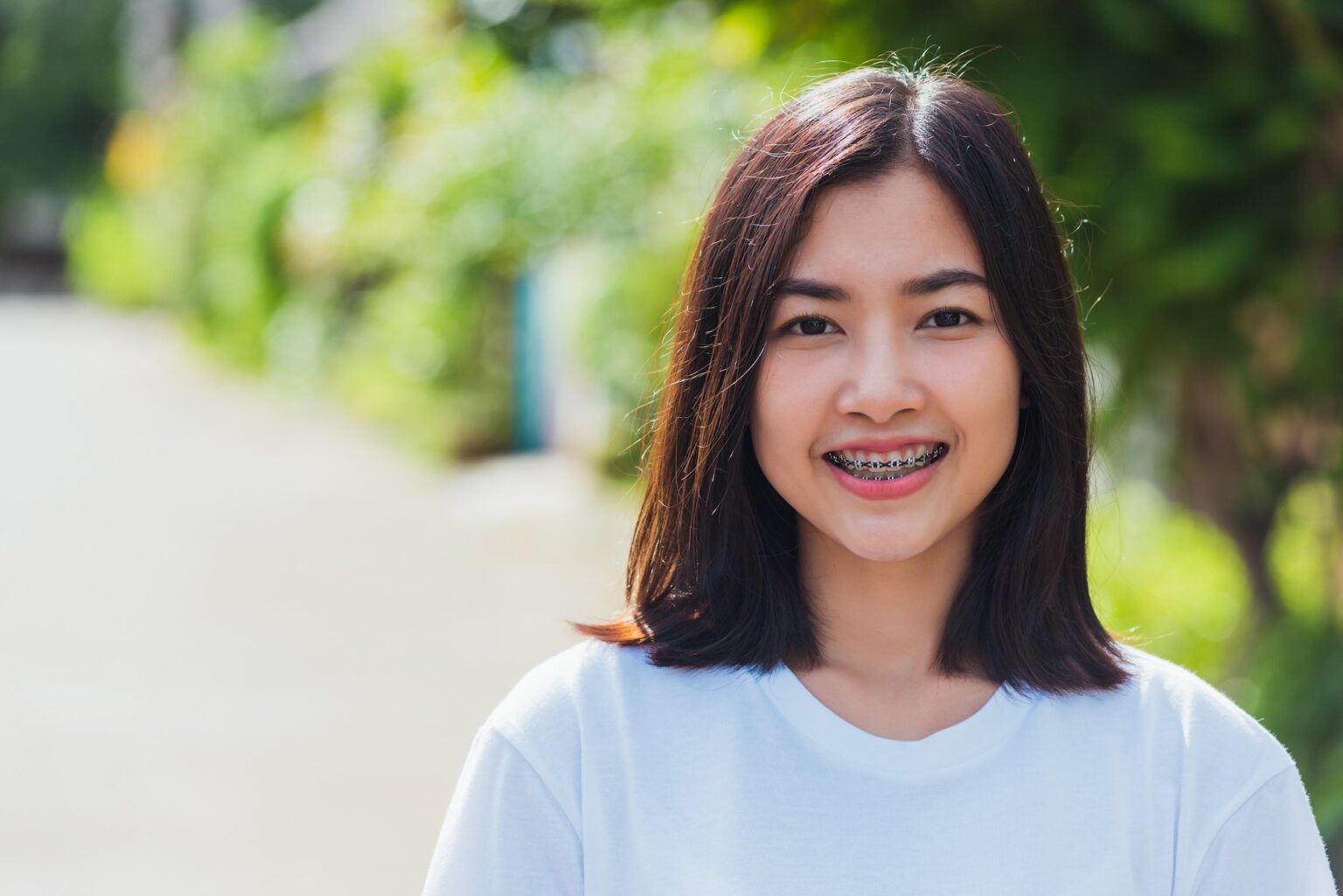 Orthodontist adjusting braces during orthodontic appointment in Allen TX